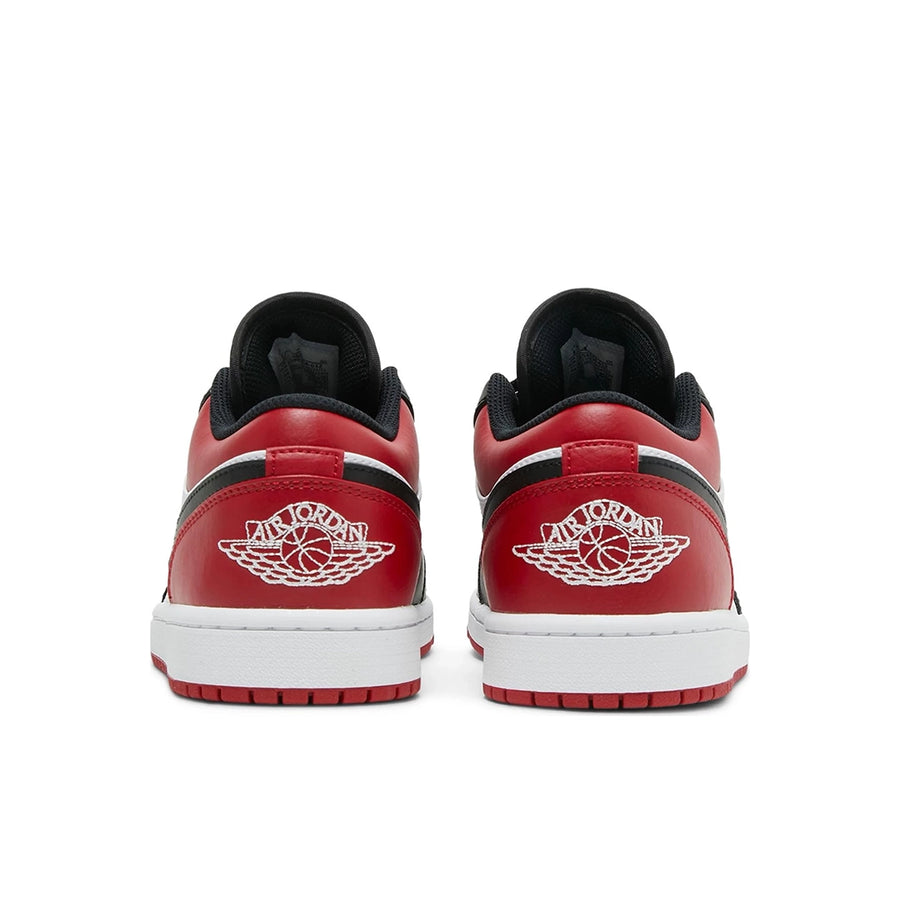 Heels of the Nike Air Jordan 1 Low Bred Toe sneakers in black and red