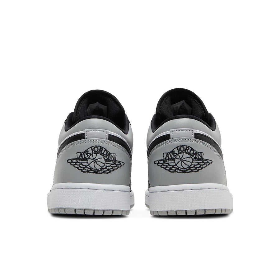 Heels of the Nike Air Jordan 1 Low Shadow Toe sneakers in grey and black