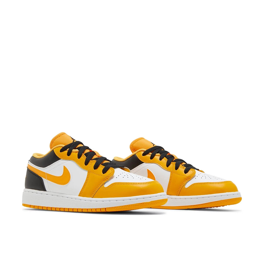 A pair of grade school Nike Air Jordan 1 Low Taxi children shoes in black, yellow and white