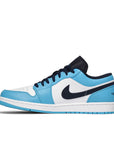 Side of Nike Air Jordan 1 Low UNC sneakers in white and blue