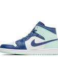 Side of the Nike Air Jordan 1 Mid Mystic Navy sneakers in blue and mint