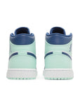Heels of the Nike Air Jordan 1 Mid Mystic Navy sneakers in blue and mint