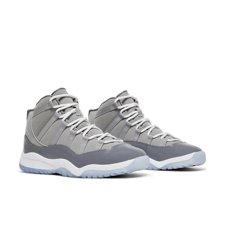 A pair of pre school kids Nike Air Jordan 11 cool grey basketball shoes in grey and white