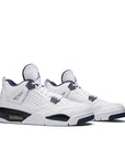 A pair of Nike Air Jordan 4 Retro Columbia 2015 basketball shoes in white and blue