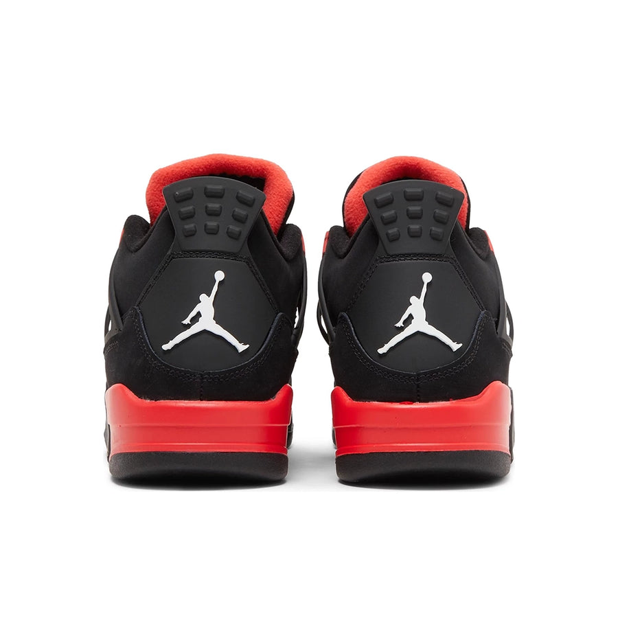 Heels of the grade school kids Nike Air Jordan 4 red thunder basketball shoes in black and red