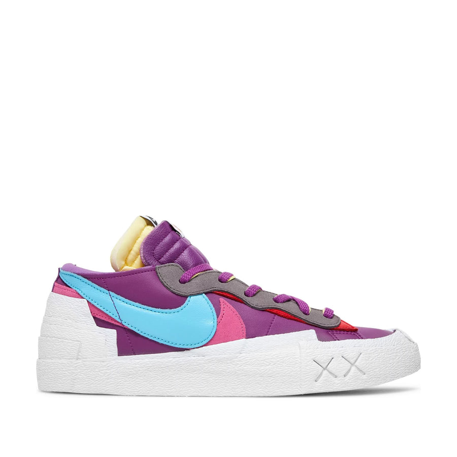 Side of the Nike Blazer Low Sacai KAWS Purple Dusk skateboard shoe in purple and white