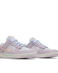 A pair of the Nike dunk low womens shoes in pink and light purple colour