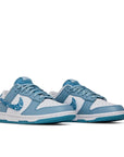 A pair of the womens Nike dunk low in a white blue "blue paisley" colour