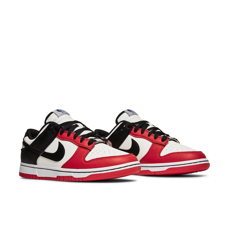 A pair of the Nike dunk low basketball shoes in a red black white chicago colour