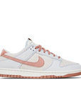 Side of the Nike dunk low fossil rose skating shoes in rose and grey