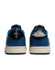 Heel of the Nike Dunk Low Fragment x Travis Scott exclusive sneakers in white. black and blue