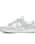 Side of the Nike dunk low in a grey white "grey fog" colour