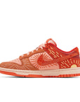Side of the Nike Dunk Low NH Winter Solstice womens sneakers in orange and yellow