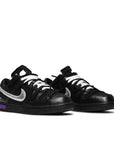 A pair of Nike Dunk Low Off White Lot 50 sneakers in black