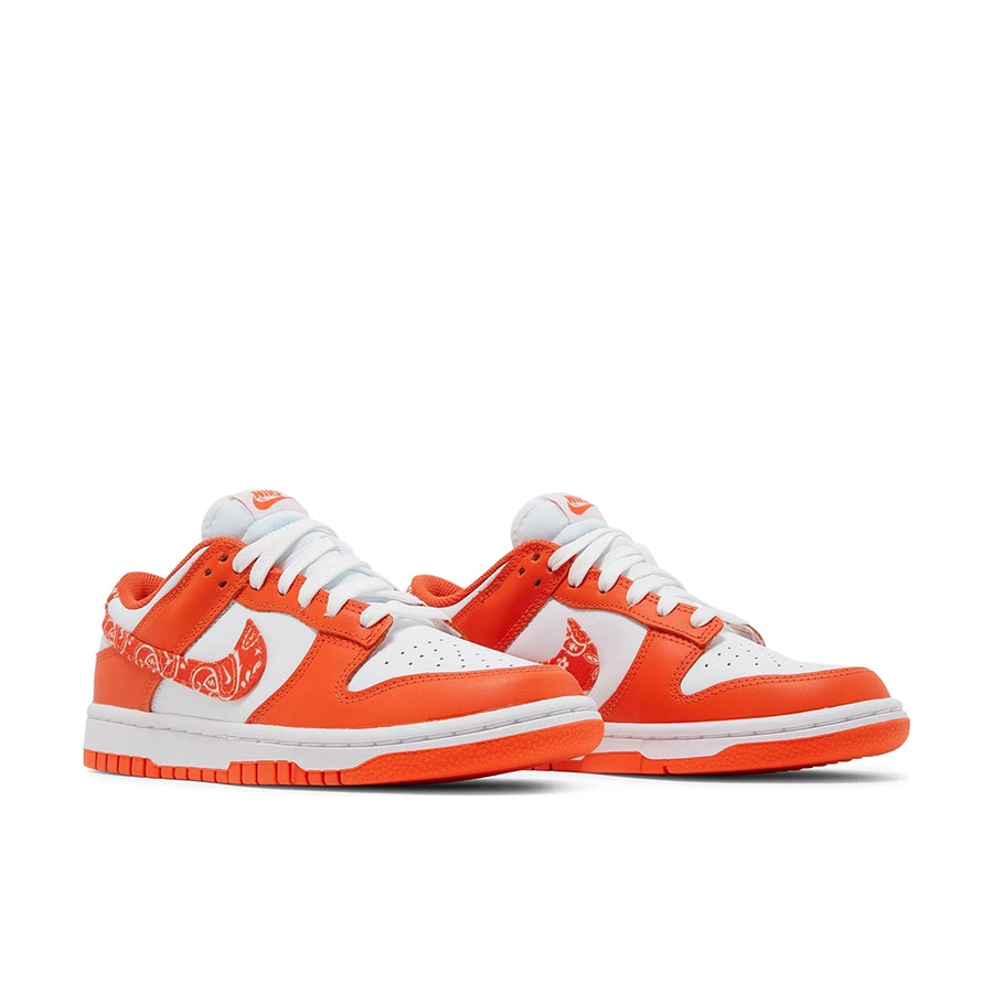 A pair of the womens Nike dunk low in a white orange "orange paisley" colour