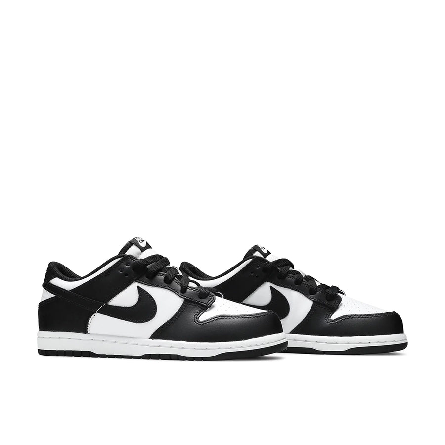 A pair of the pre-school version Nike dunk low in a black white "Panda" colour