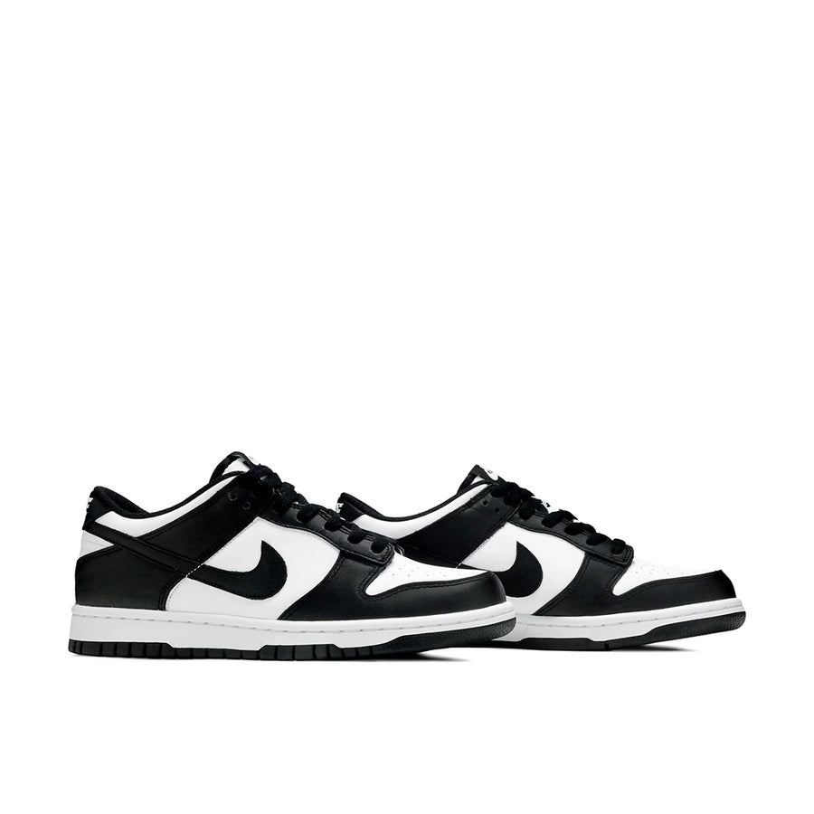 A pair of the  older kids version Nike  dunk low in a black white "Panda" colour
