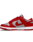 Side of the Nike dunk low retro in a grey red unlv colour