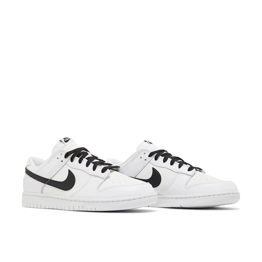 A pair of Nike Dunk Low Reverse Panda basketball shoes in white and black