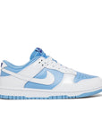 Side of the Nike Dunk Low Reverse UNC womens sneakers in white and blue