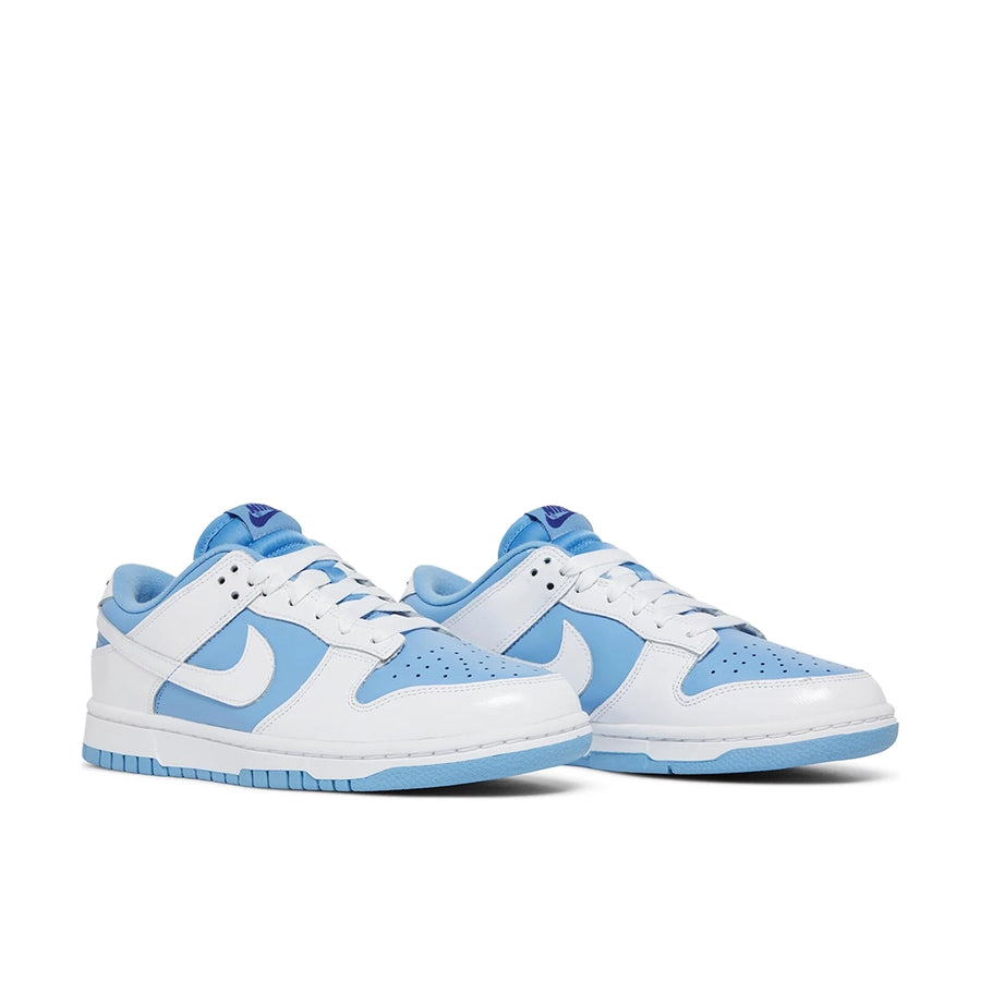 A pair of Nike Dunk Low Reverse UNC womens sneakers in white and blue