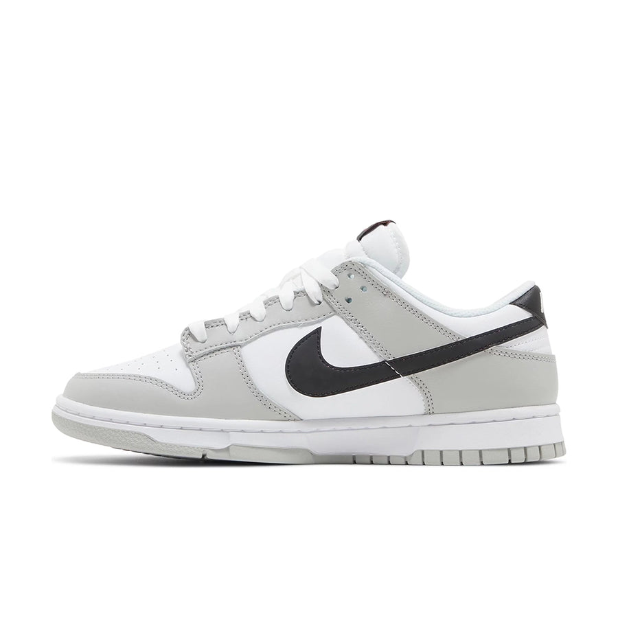 Side of the Nike Dunk Low SE Lottery Pack sneakers in grey
