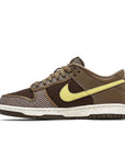 Side of the Nike dunk low sp undefeated canteen in brown and lemon