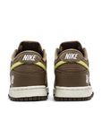 Heel of the Nike dunk low sp undefeated canteen in brown and lemon