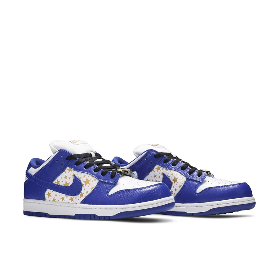 A pair of the Nike dunk supreme low skating shoes in a gold stars white blue hyper royal colour