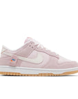 Side of Nike Dunk Low Teddy Bear (W) in soft pink and white.