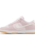 Side of Nike Dunk Low Teddy Bear (W) in soft pink and white.