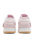 Heels of Nike Dunk Low Teddy Bear (W) in soft pink and white.
