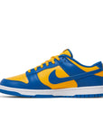 Side of the Nike dunk low in a yellow blue "ucla" colour