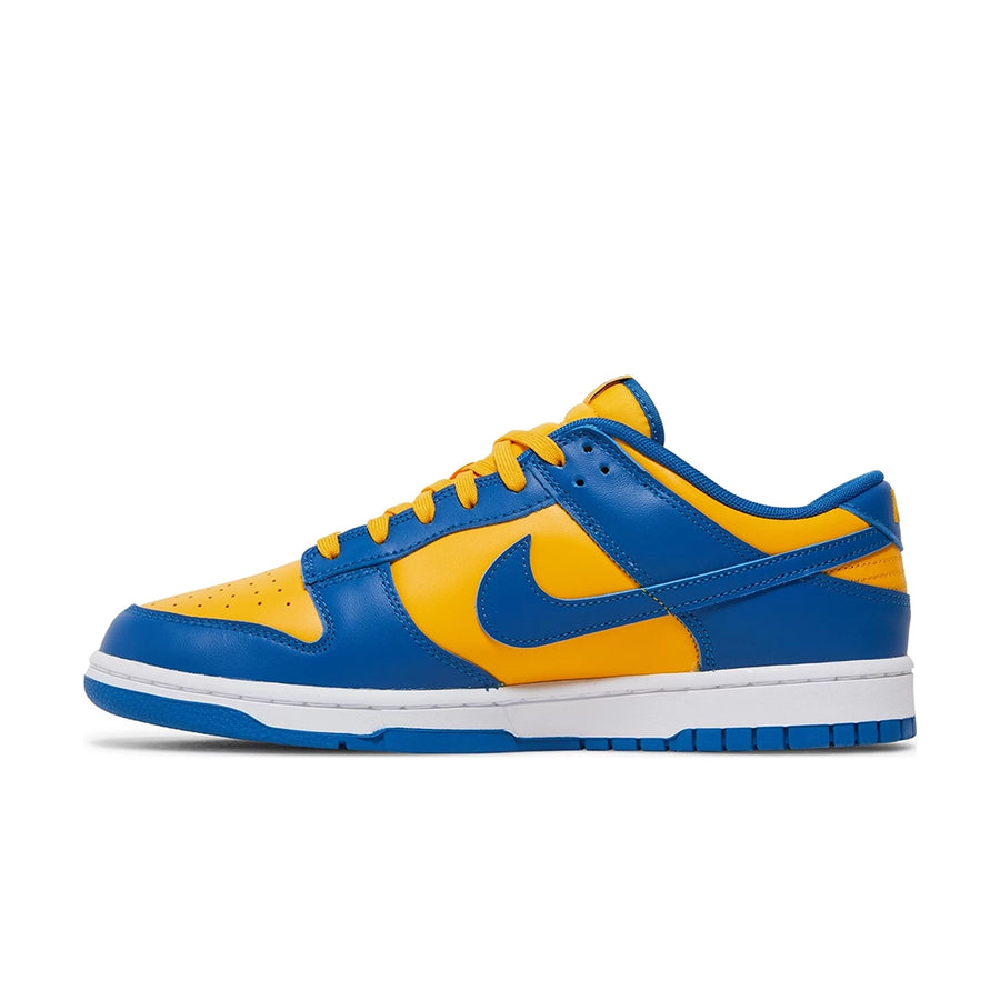 Side of the Nike dunk low in a yellow blue "ucla" colour