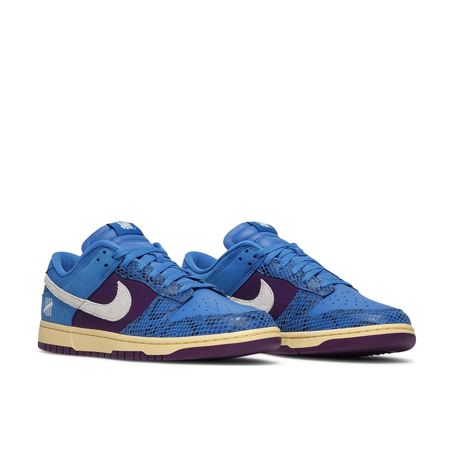 A pair of the Nike dunk low undefeated 5 On It in a blue exotic colour