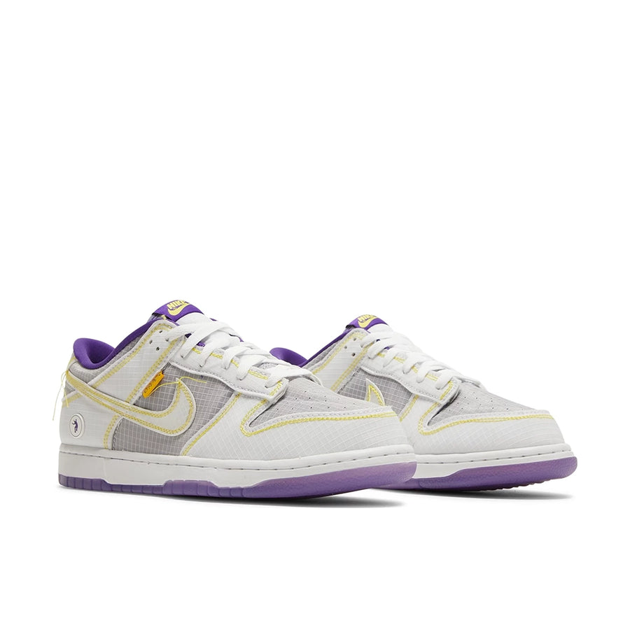 A pair of Nike Dunk Low Union Passport Pack Court Purple sneakers