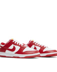A pair of the Nike dunk lows in a white red "usc" colour