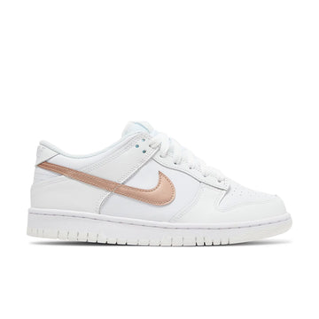 Side of the Nike dunk low grade school sneaker in white and pink