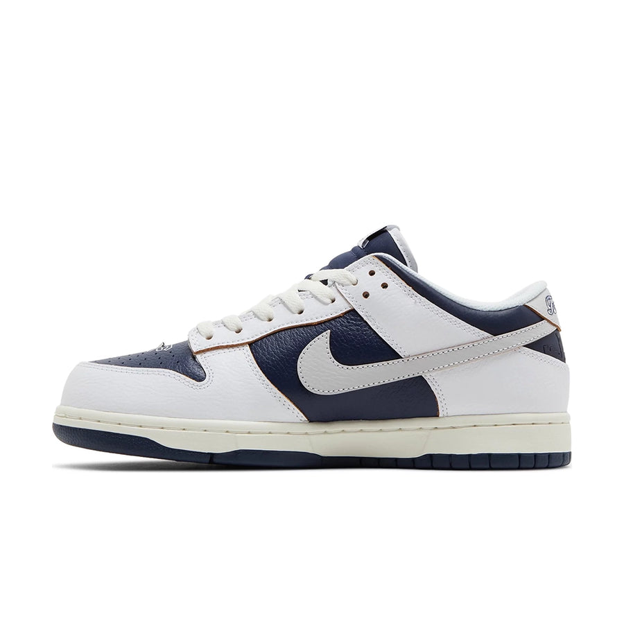 Side of Nike SB Low HUF New York in navy and white.