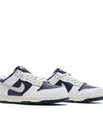 Pair of Nike SB Low HUF New York in navy and white.