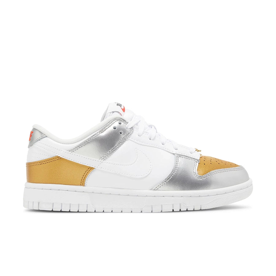 Side of the Nike SB Dunk Low Heirloom womens shoe in white and gold