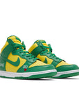 A pair of the Nike sb dunk high supreme skating shoes in yellow green brazil colour