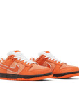 Pair of Nike SB Dunk Low Concepts Orange Lobster in Orange.
