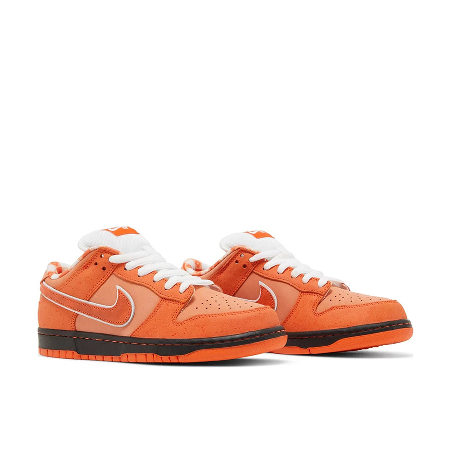 Pair of Nike SB Dunk Low Concepts Orange Lobster in Orange.