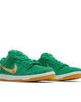 A pair of  Nike sb dunk low skating shoes in a green St Patricks Day colour