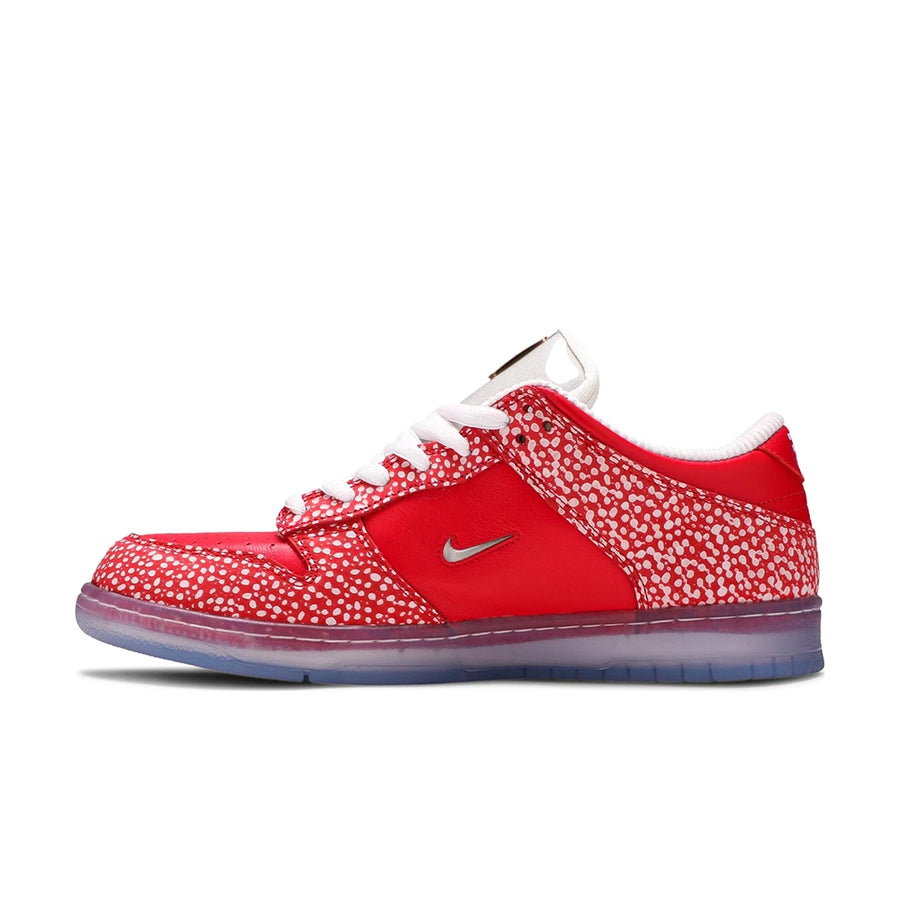 Side of the Nike sb dunk low stingwater magic mushroom skating shoes in red and white