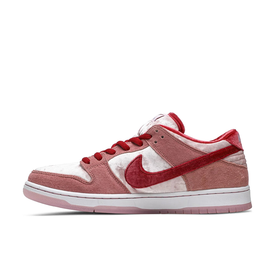 Side of the Nike sb dunk low StrangeLove Skateboard skating shoes in a pink colour