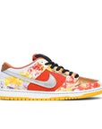 Side of the Nike sb dunk low street hawker skating shoes in a chinese print