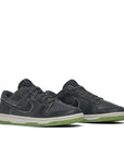A pair of Nike Dunk Low Swoosh Shadow Iron Grey sneakers in grey