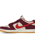 Side of the Nike sb dunk low pro skate like a girl skating shoes in burgundy and cream